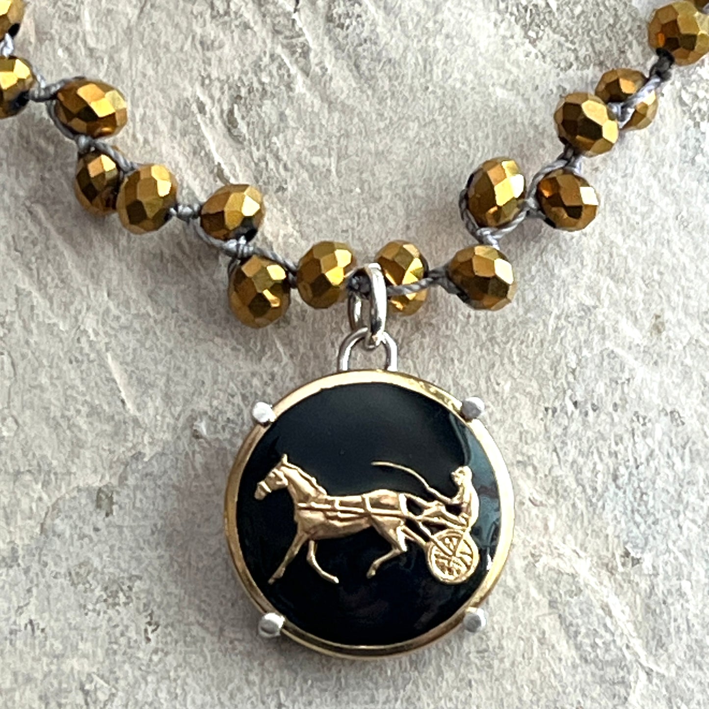 Gilt Trotter Button on Gold Crystal Necklace