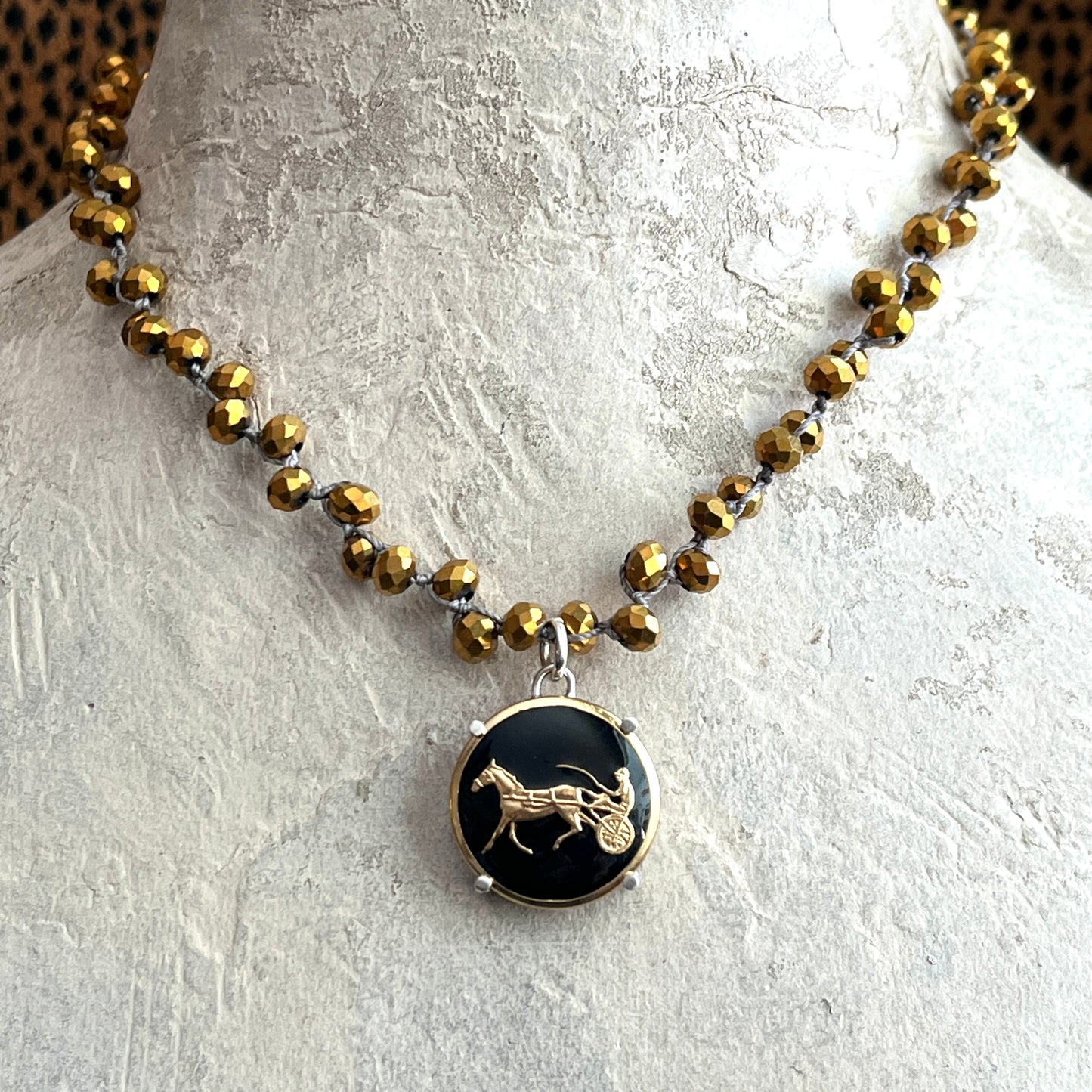Gilt Trotter Button on Gold Crystal Necklace