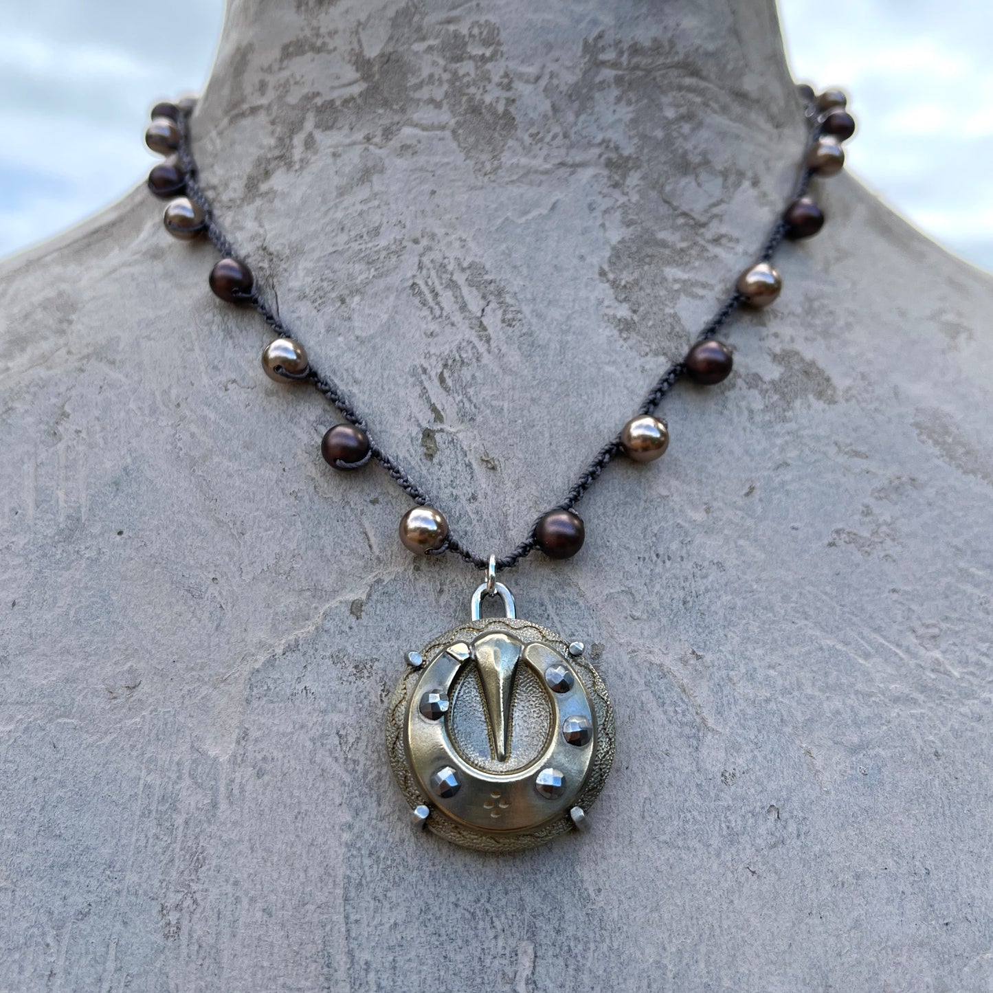 Vintage Brass and Steel Cuts Horseshoe Button Necklace