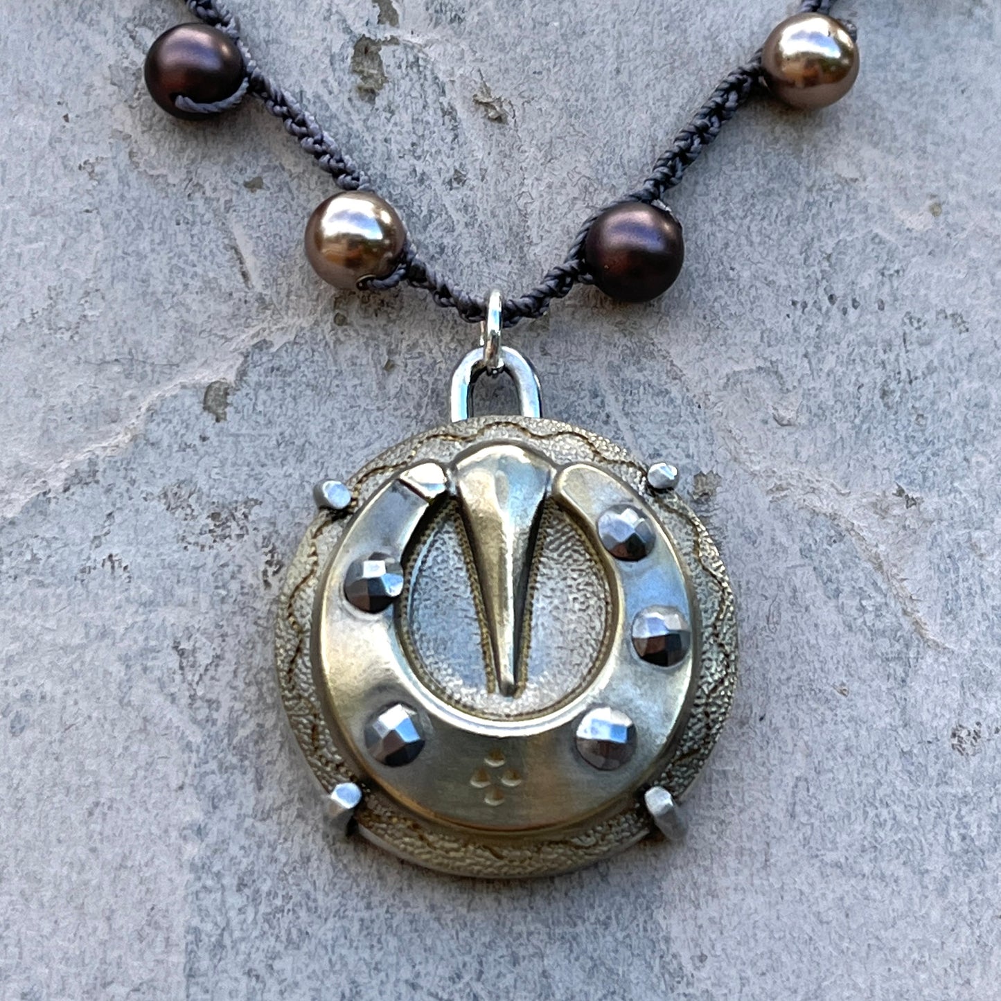 Vintage Brass and Steel Cuts Horseshoe Button Necklace