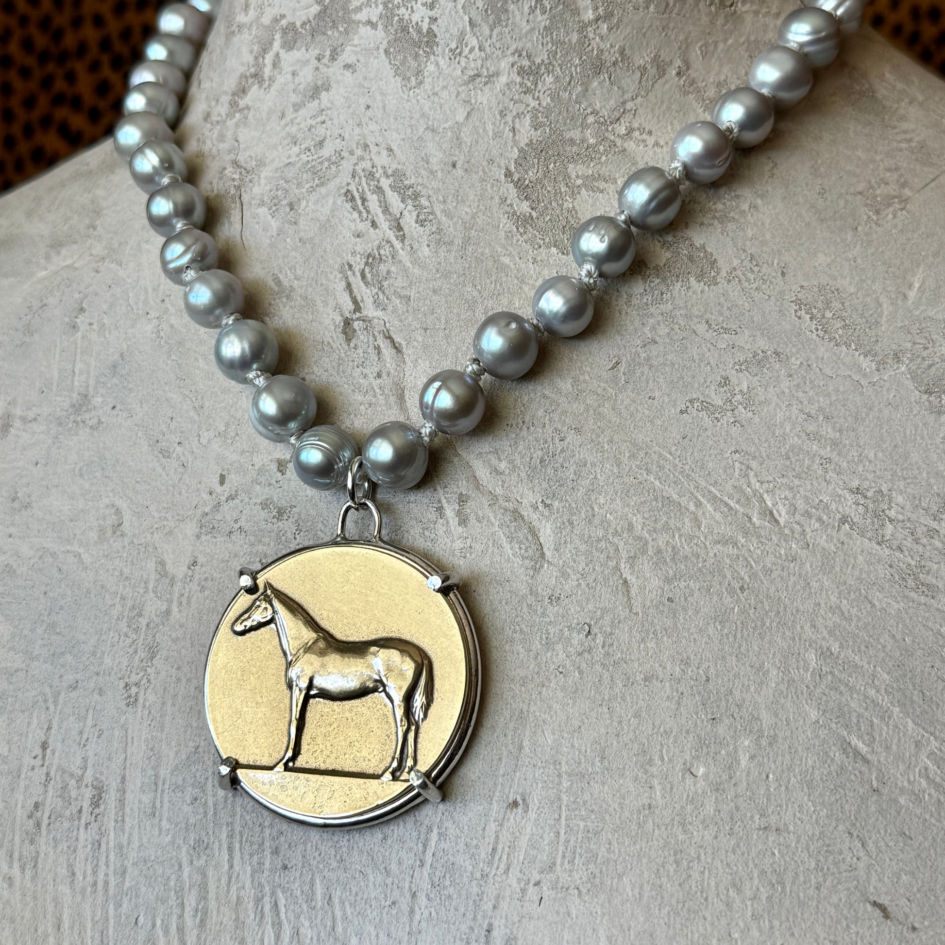 Standing Horse Medal on Pearl Necklace