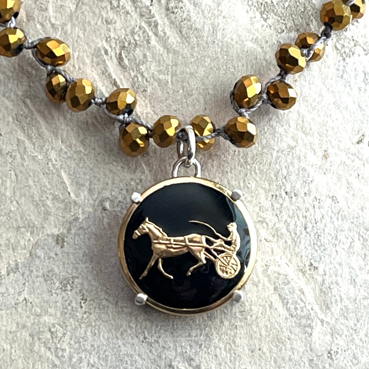 Gilt Trotter Button on Gold Crystal Necklace