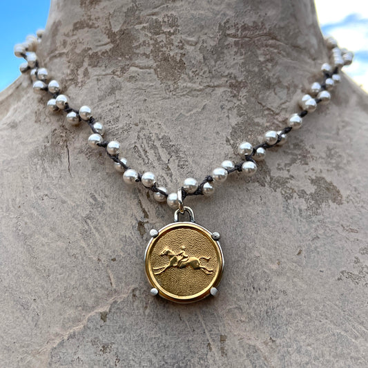 Brass Galloping Horse Button on White Pearl Necklace