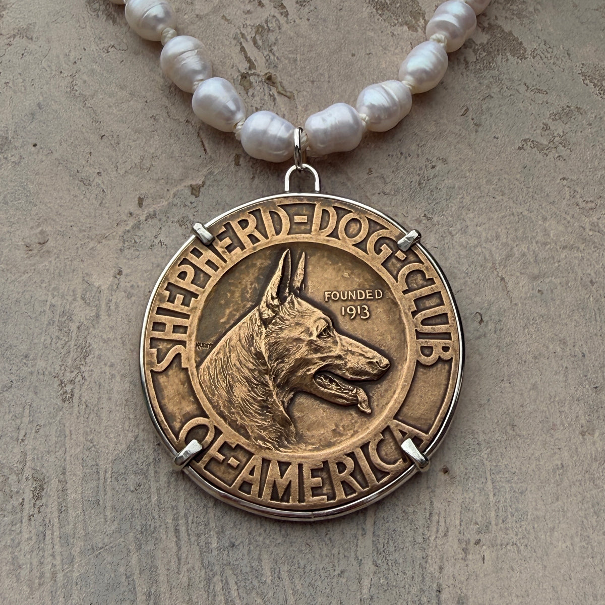 Bronze Shepherd Dog on Pearl Necklace