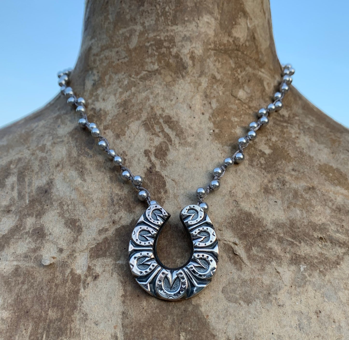Lucky Seven Horse Shoe on Silver Pearls